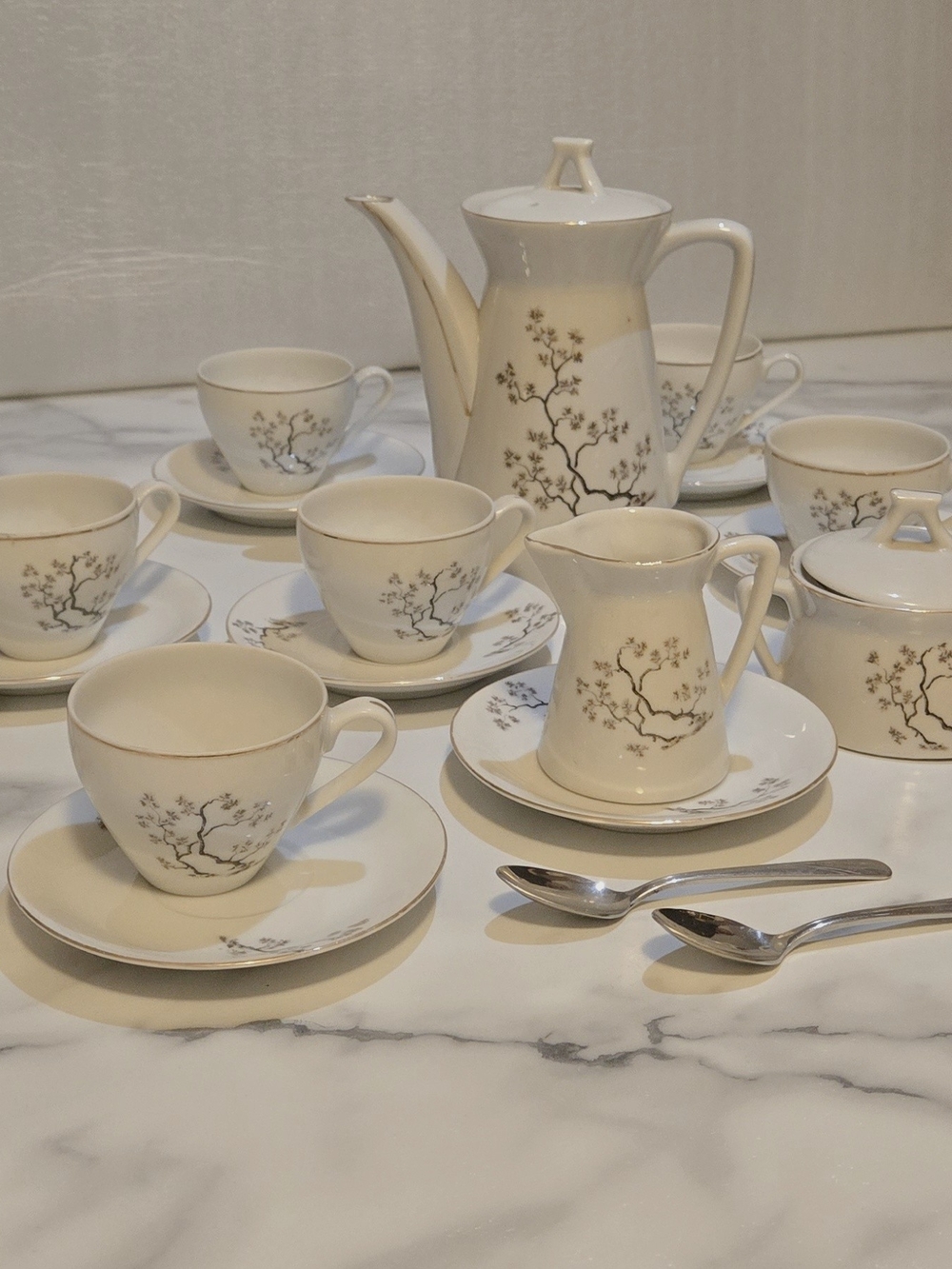 Elegant Cream Porcelain Tea Set with Floral Branch Motif
